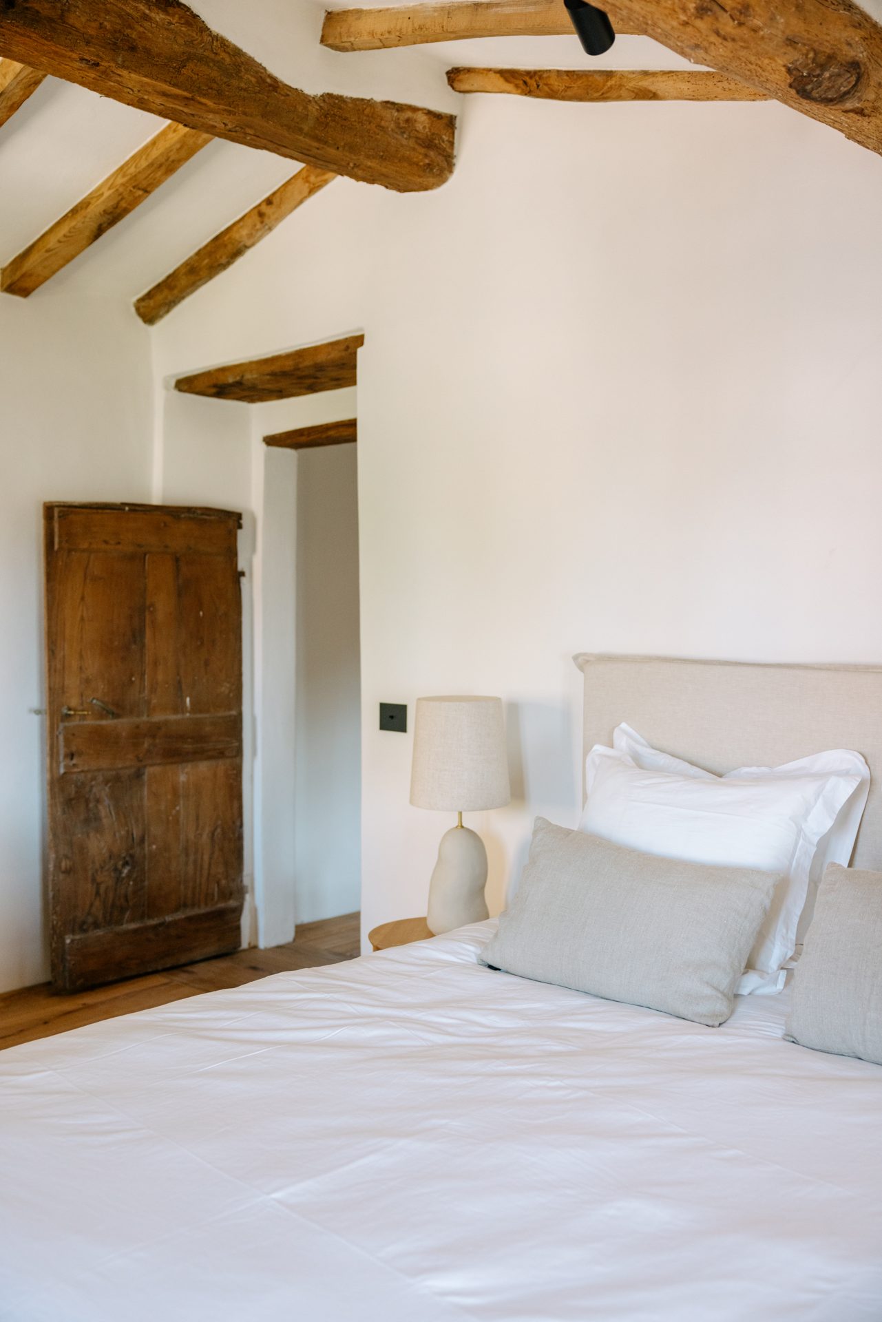 Timber roof structure kept above an upper-floor room